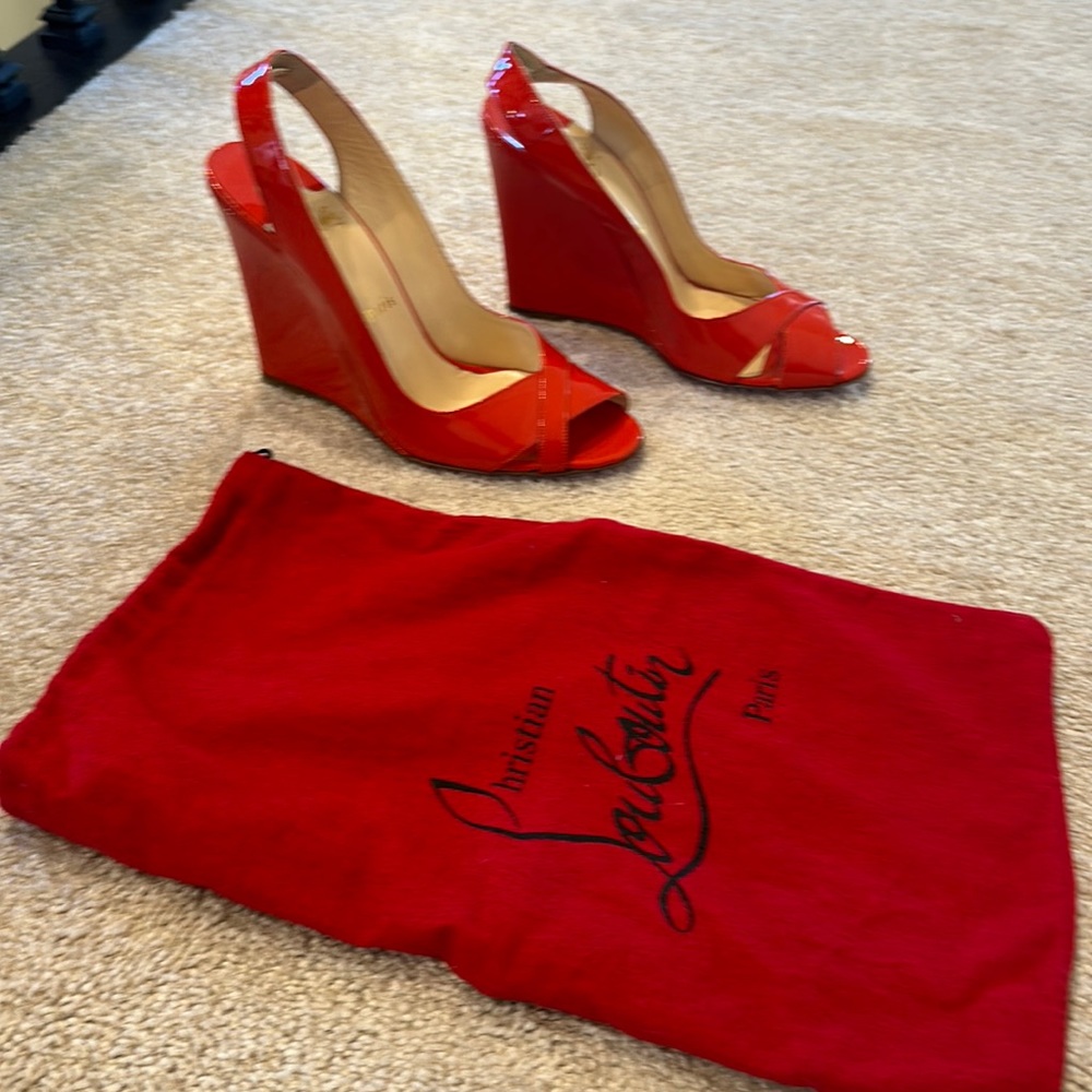 Brand new Louboutin wedges in patent leather bright red color. Size 39.5